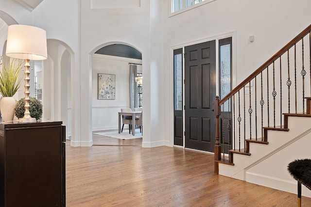 foyer with wood-type flooring