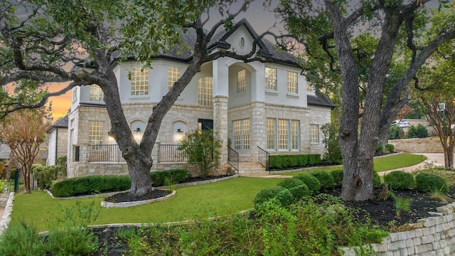 view of front of house with a yard