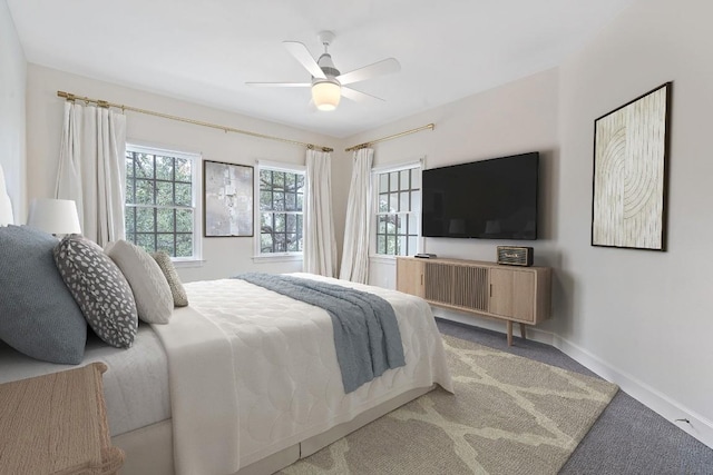 carpeted bedroom featuring ceiling fan