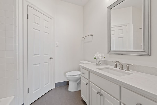 bathroom featuring tile patterned floors, walk in shower, vanity, and toilet