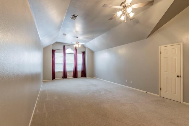 bonus room featuring ceiling fan, light carpet, and lofted ceiling