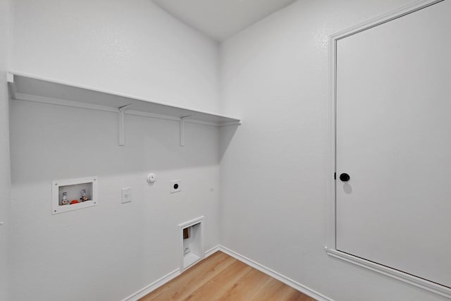 laundry area with light wood-type flooring, laundry area, hookup for a washing machine, hookup for a gas dryer, and hookup for an electric dryer