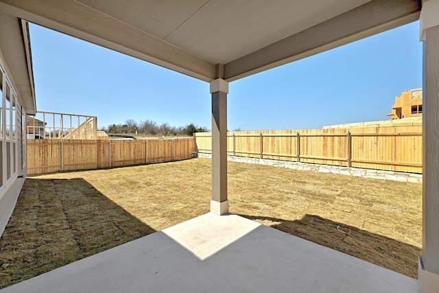 view of yard with a fenced backyard and a patio area