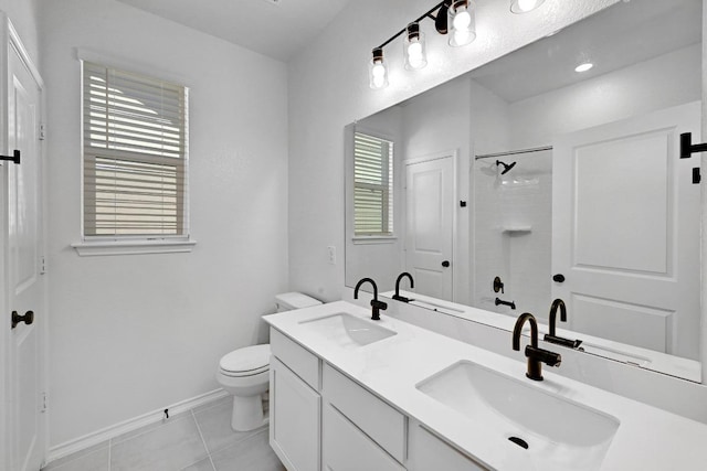 full bathroom with tile patterned flooring, toilet, walk in shower, and a sink