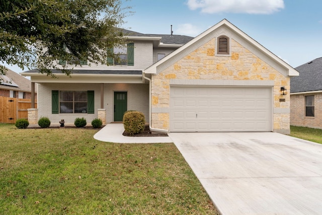 view of front of home with a front yard and a garage