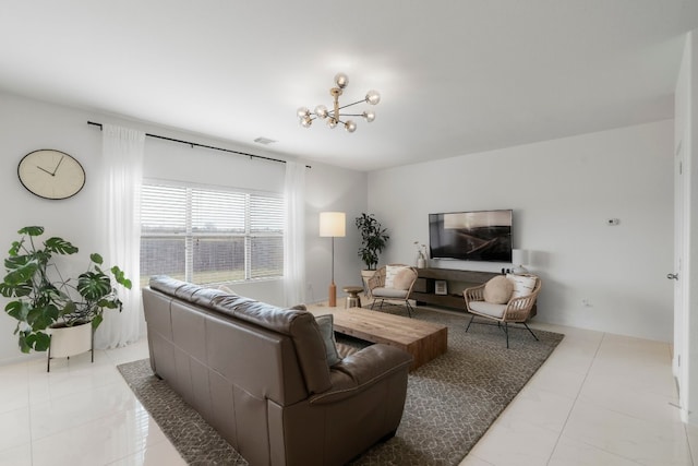 tiled living room featuring a notable chandelier