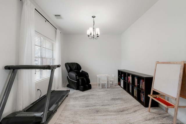 workout room with an inviting chandelier