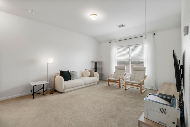 living room with light carpet and vaulted ceiling