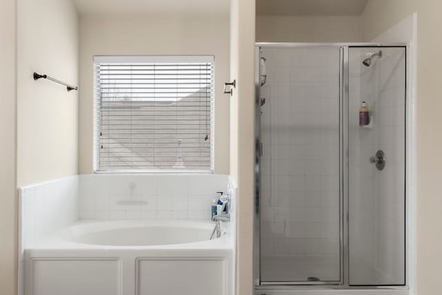 bathroom with separate shower and tub