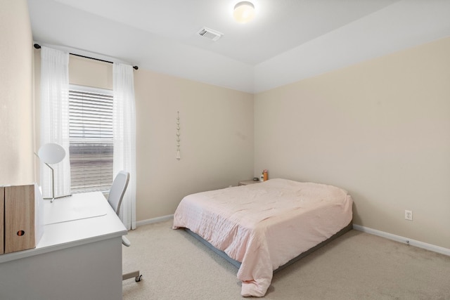 bedroom with light carpet