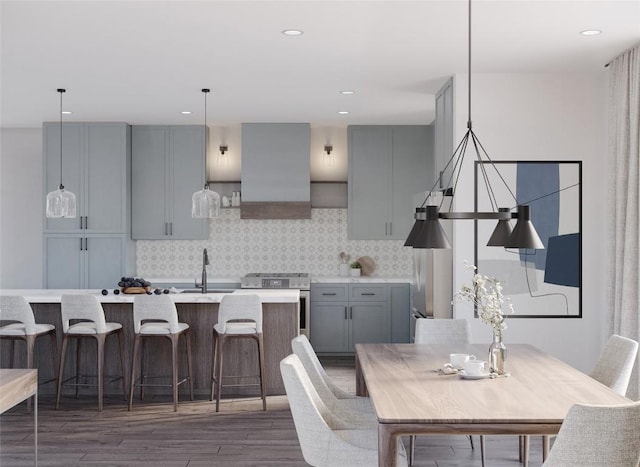 dining room featuring sink and dark hardwood / wood-style floors