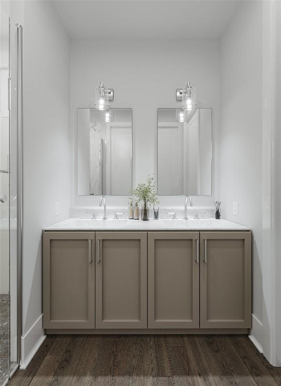 bathroom featuring a shower, vanity, and wood-type flooring