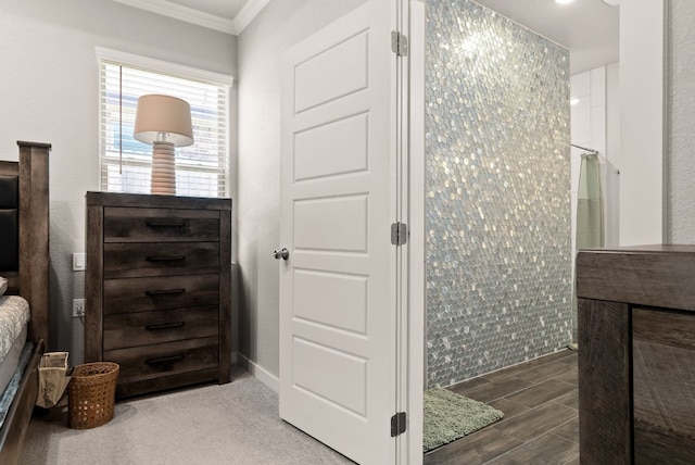 bathroom featuring a shower and ornamental molding