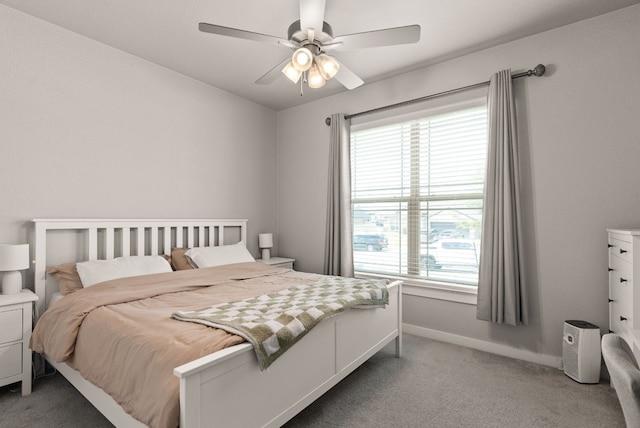 bedroom featuring multiple windows, carpet floors, and ceiling fan