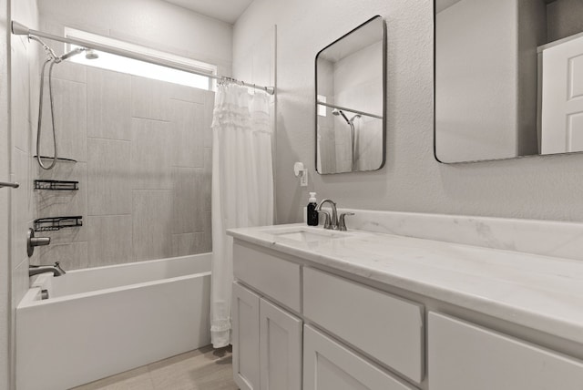 bathroom with shower / bath combo and vanity