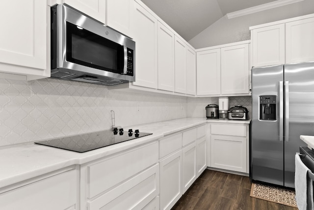 kitchen featuring white cabinetry, crown molding, and stainless steel appliances