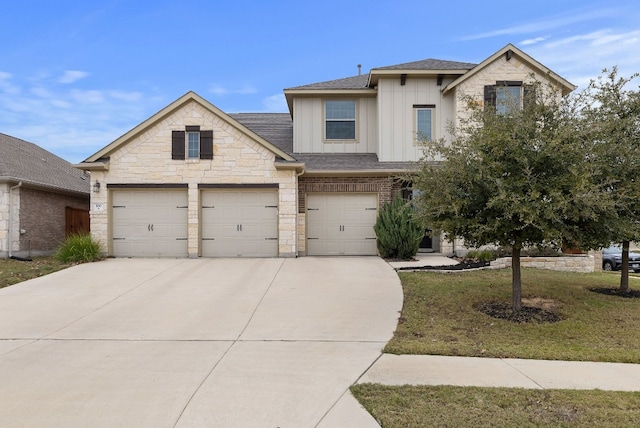 view of front facade featuring a garage and a front lawn