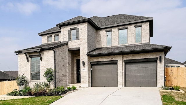 267 Carpenter Hill Dr, Buda, TX 78610 - view of front facade with brick siding, a garage, driveway, and a shingled roof