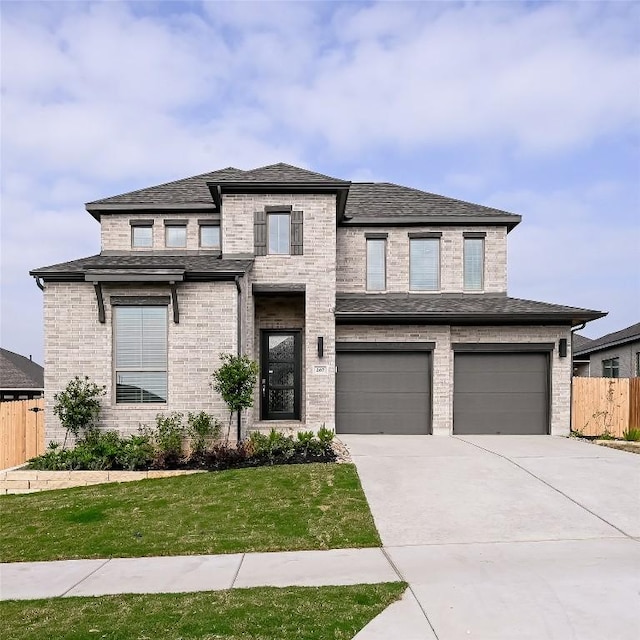 267 Carpenter Hill Dr, Buda, TX 78610 - view of front of property featuring driveway, an attached garage, brick siding, and a shingled roof
