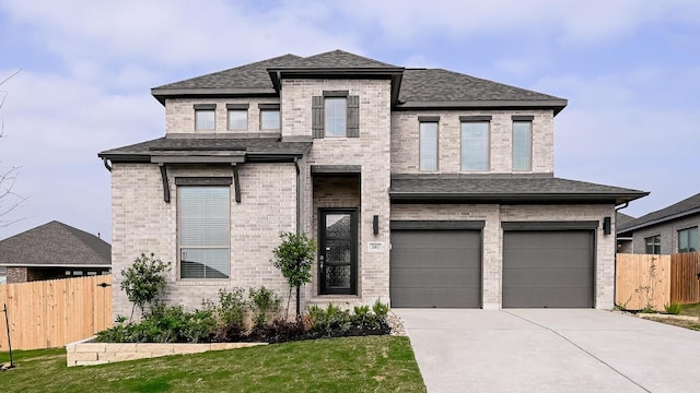 267 Carpenter Hill Dr, Buda, TX 78610 - view of front of property featuring an attached garage, brick siding, concrete driveway, and a shingled roof