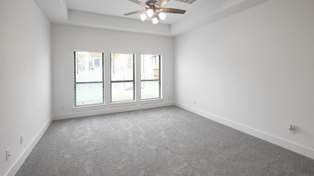 unfurnished room featuring ceiling fan, carpet, and baseboards
