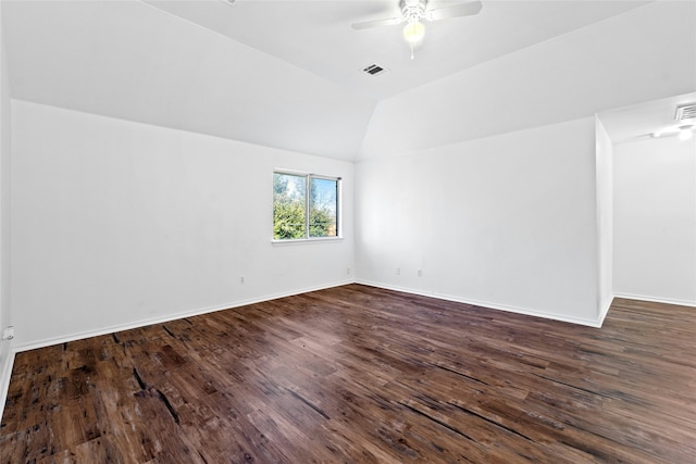 unfurnished room featuring ceiling fan, dark hardwood / wood-style flooring, and lofted ceiling