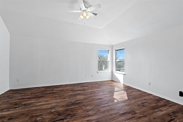 empty room featuring ceiling fan and dark wood-type flooring