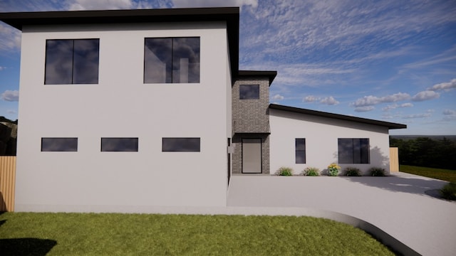 20904 Marquette Cv, Lago Vista, TX 78645 - back of property with stucco siding, brick siding, and a patio
