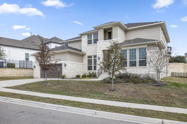 view of front of house featuring a garage and a front yard