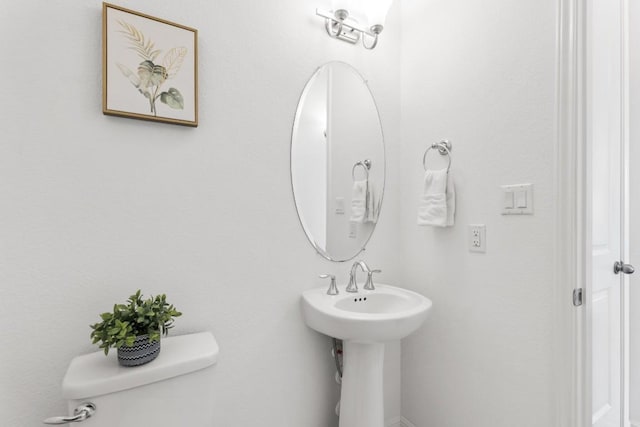 bathroom featuring sink and toilet