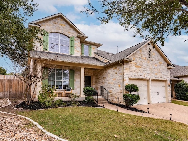 view of front of house with a front yard and a garage