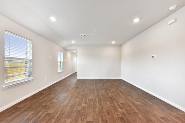 spare room featuring dark hardwood / wood-style floors