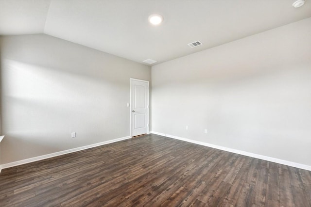 unfurnished room with dark hardwood / wood-style floors and lofted ceiling