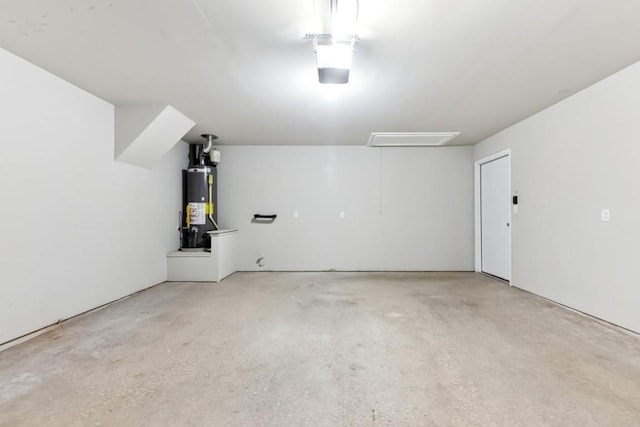 garage with a garage door opener and water heater