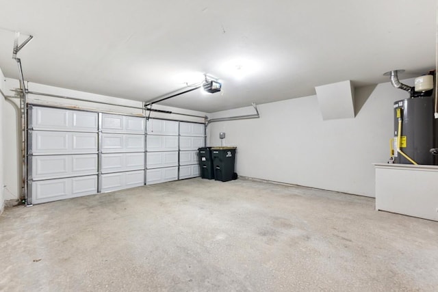 garage featuring a garage door opener and water heater