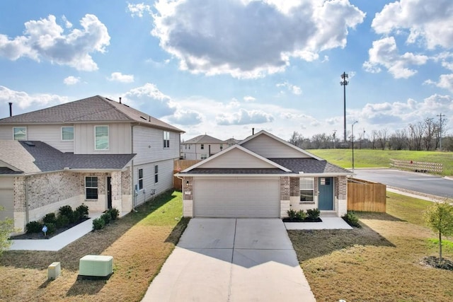 view of front of home with a front yard and a garage