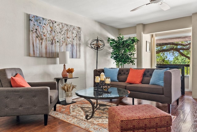 living room featuring hardwood / wood-style floors and ceiling fan