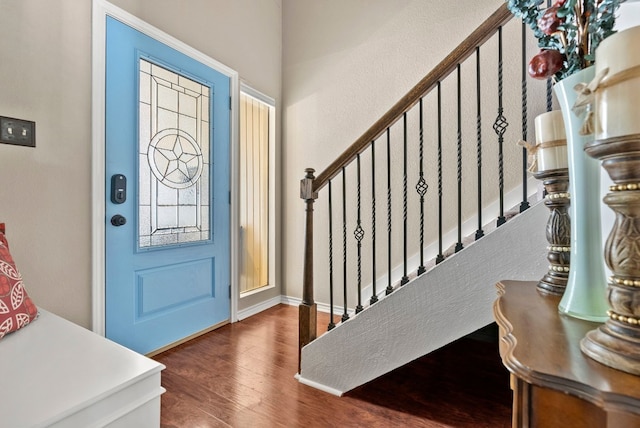 entrance foyer with dark hardwood / wood-style flooring