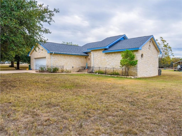 single story home with a front lawn and a garage