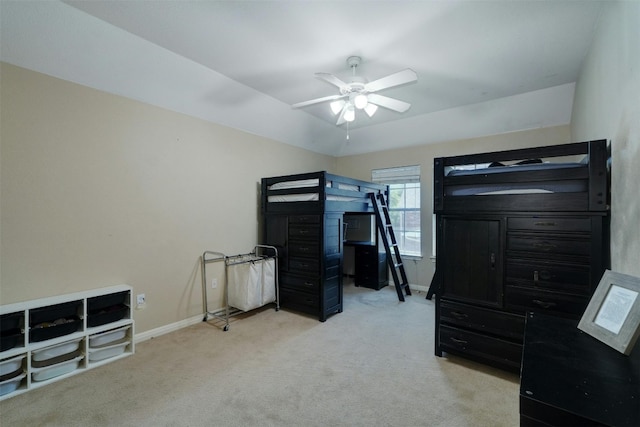 bedroom featuring light colored carpet and ceiling fan