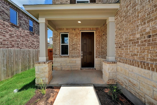 doorway to property featuring a porch