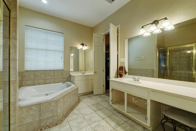 bathroom featuring tile patterned floors, vanity, and independent shower and bath