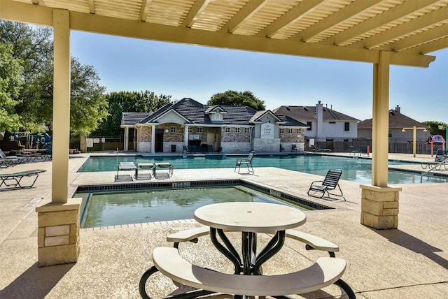 view of pool with a pergola and a patio