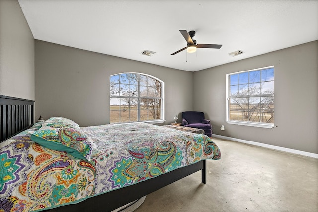 bedroom with concrete flooring and ceiling fan