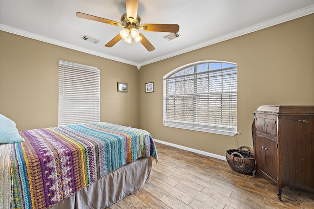 bedroom with ceiling fan, light hardwood / wood-style flooring, and crown molding