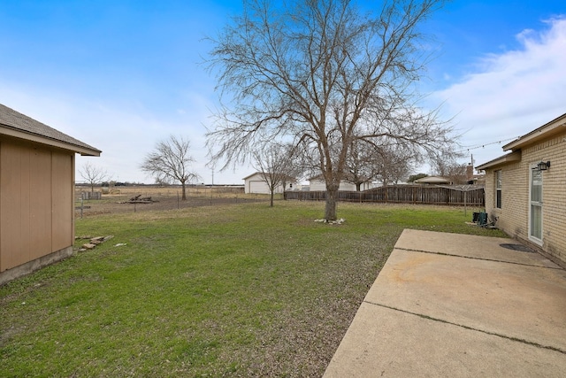 view of yard with central air condition unit and a patio area