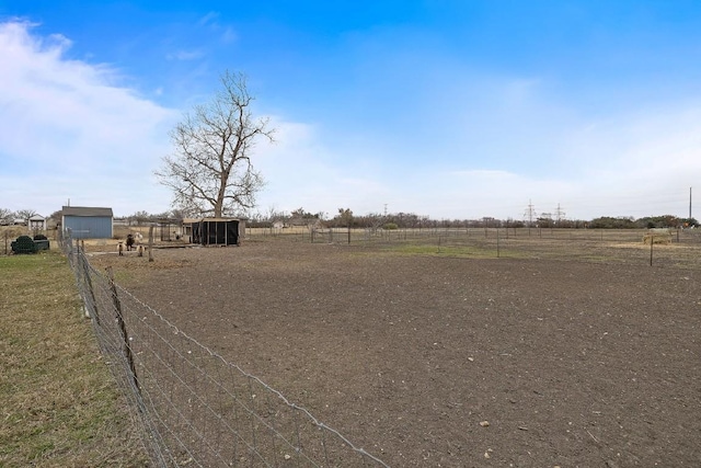 view of yard with a rural view