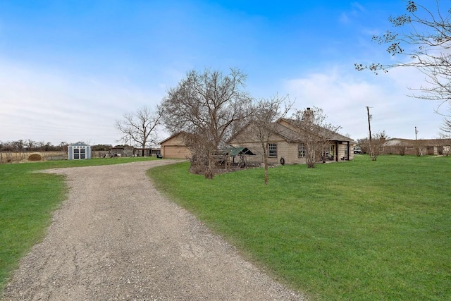 single story home with a front lawn and a storage shed