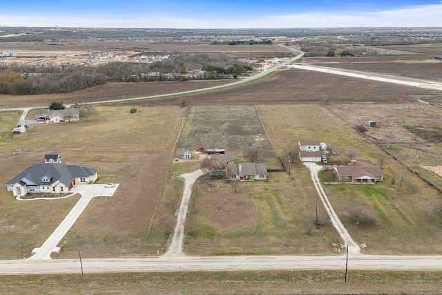 birds eye view of property featuring a rural view