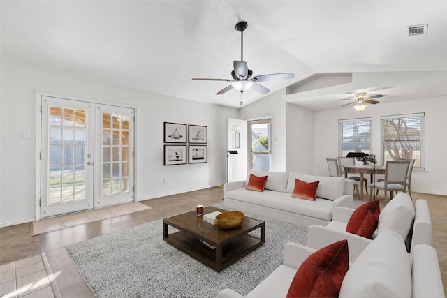 living room featuring french doors, light tile patterned floors, ceiling fan, and lofted ceiling